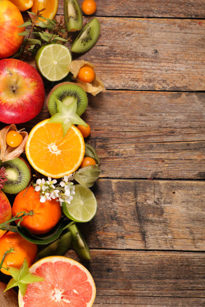 istock assorted of fresh fruit with orange, kiwi, apple and pomegranate 1334981786
