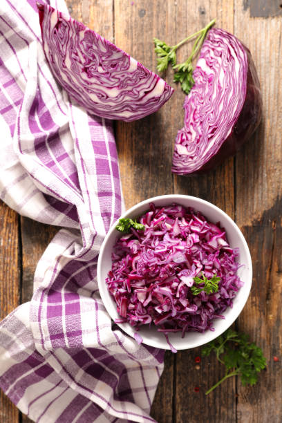 istock red cabbage salad on wood background 1334982380