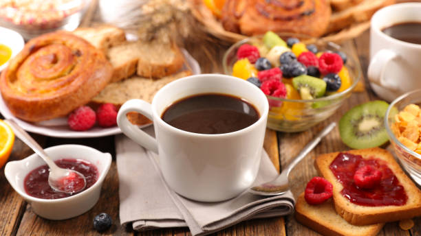 istock coffee cup with croissant and fresh fruits 1334982609