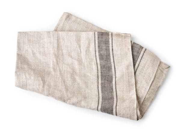 istock Kitchen grey folded table cloth isolated on white background. Top view of napkin. 1334983400