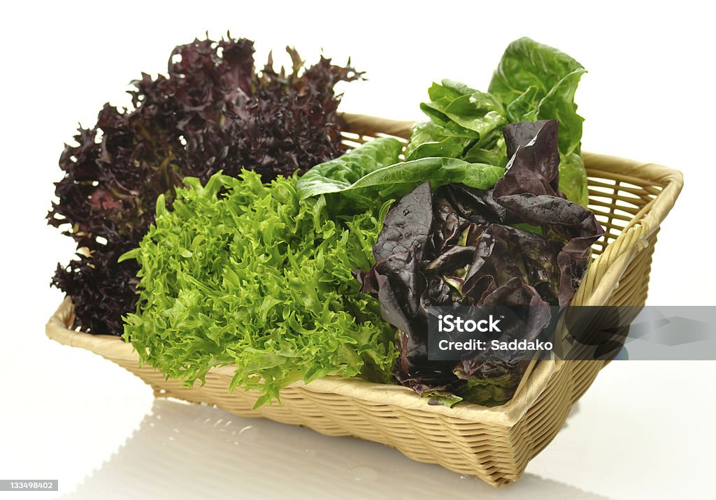 salad leaves assortment of salad leaves in a basket Basket Stock Photo