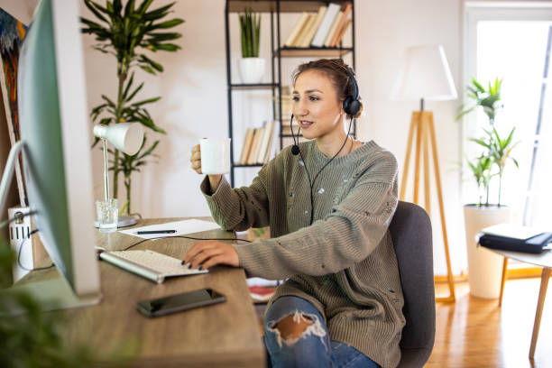 istock Young woman having a video conference while working from home 1334984805