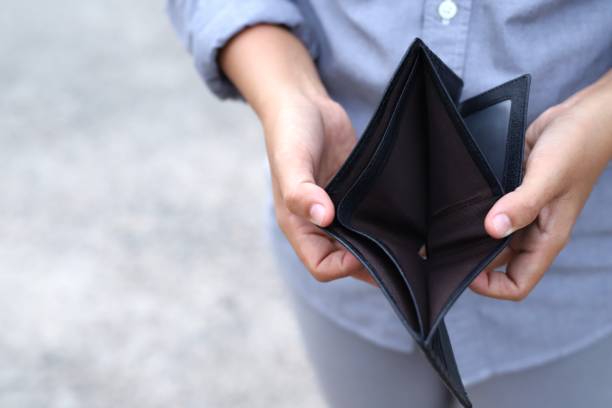 istock Man opens an empty wallet because of the impact of COVID-19 1334984921