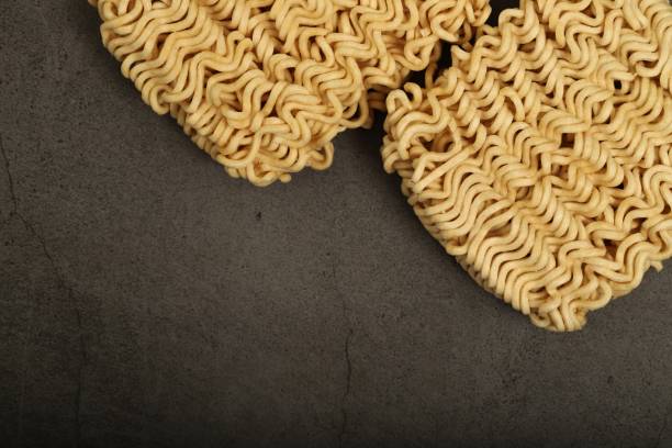 istock raw instant noodles on gray background 1334985326