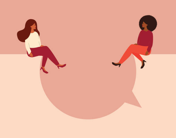 istock Women talking concept. Strong girls sitting and having a discussion on a big speech bubble while looking to each other. 1334987866