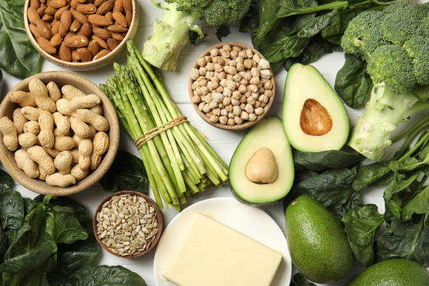 istock Different products rich in vitamin E on white wooden table, flat lay 1334989778