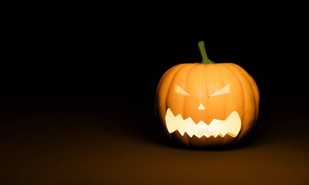 istock Halloween pumpkin with illuminated scary face 1334989793
