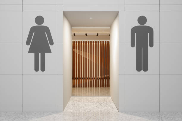 壁に掛かる男性と女性のシンボルを持つ公衆トイレの入り口 - public restroom bathroom restroom sign sign ストックフォトと画像