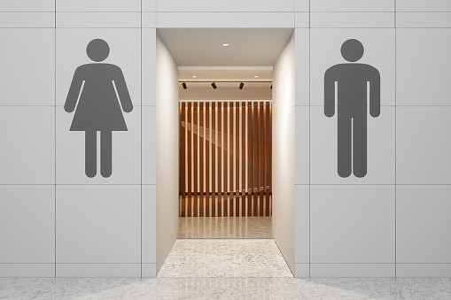 Public Restroom Entrance With Male And Female Symbol Hanging On The Wall