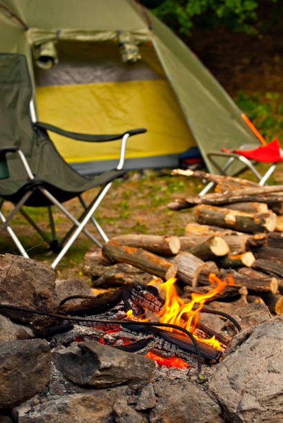 istock Empty armchairs for relaxing on a campfire background. Beach chairs around the fire. Night vacation in nature. 1334991063