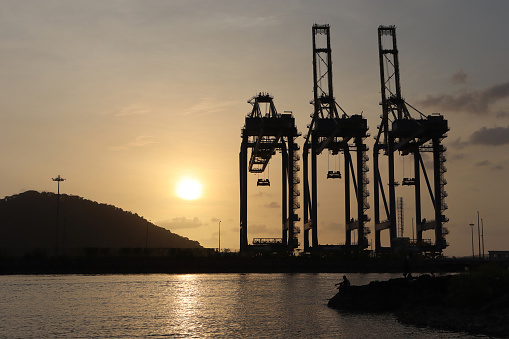 Silouette of huge cranes at Dockyard, Shipping port, Nhava Seva, Uran,  Maharashtra, India
