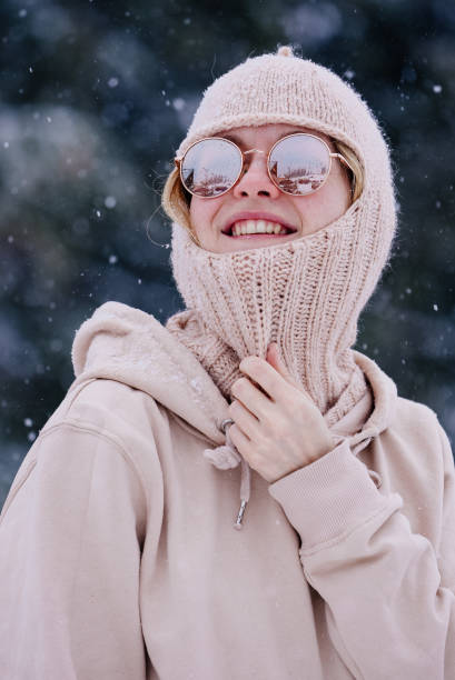 istock woman in winter clothes handknit hat 1334991349