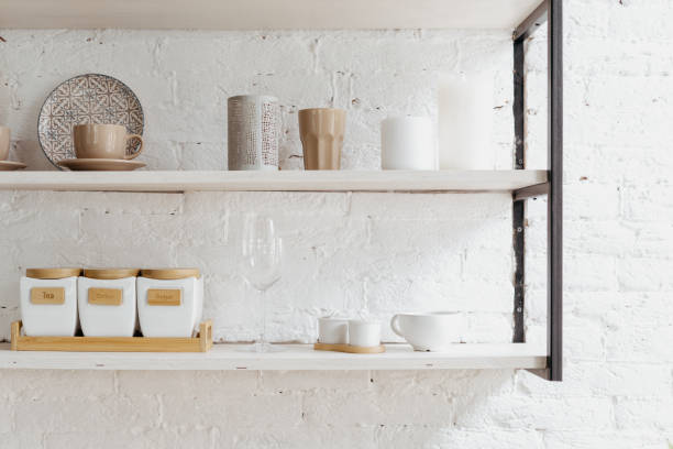 istock Closeup of wooden shelf at white kitchen. 1334993407