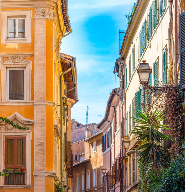 istock Blue sky over a narrow street in Rome 1334993608