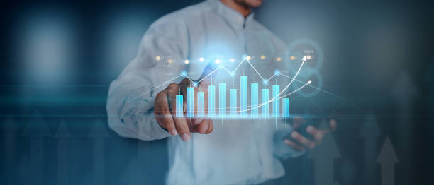 istock Money businessman touch virtual screen screen displaying a crypto currency featuring stock tickers or graphs. Stock trading platform concept. professional financial. Stock market data candlesticks. 1334995368