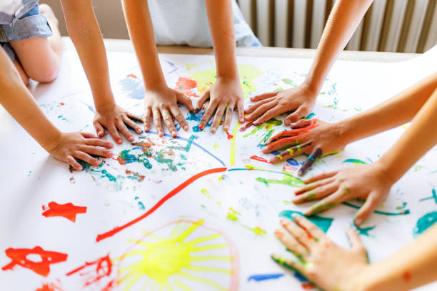 istock Group of children having fun whit colors 1334998730