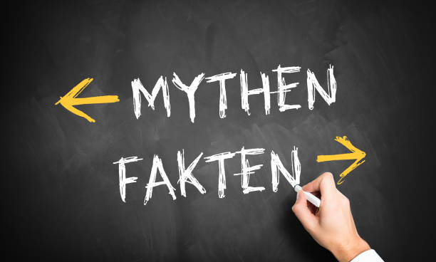 istock hand writing German message for MYTHS and FACTS on a chalkboard 1334999764