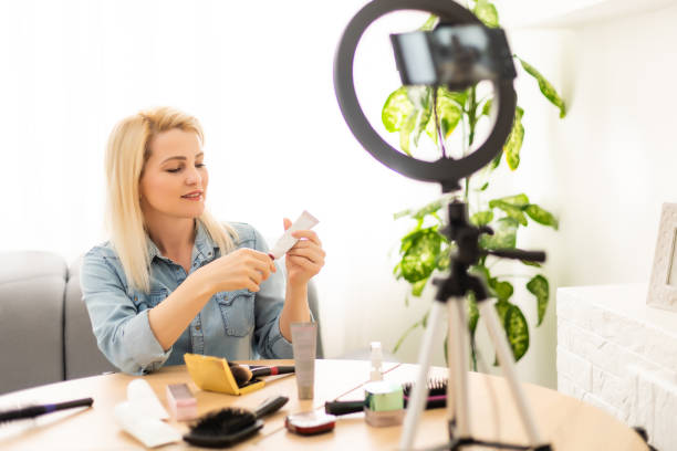 istock Female Vlogger Recording Broadcast At Home 1335001443