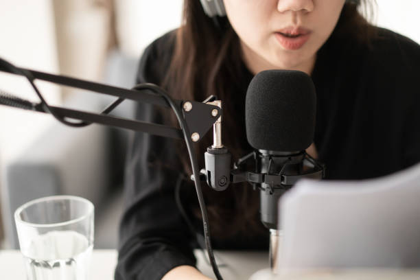 istock Asian young beautiful woman making a podcast live steaming. 1335003739