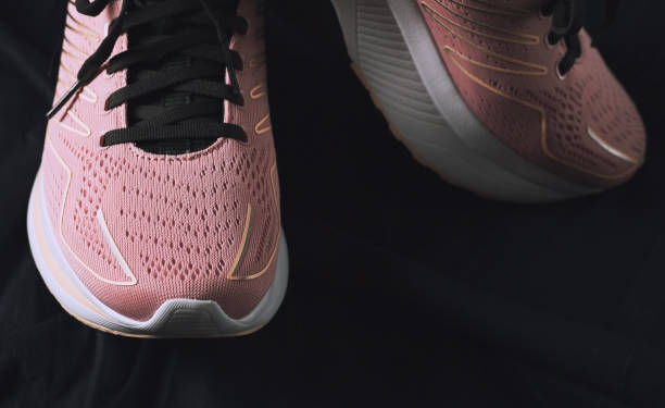istock Stylish pink sneakers close up 1335003886