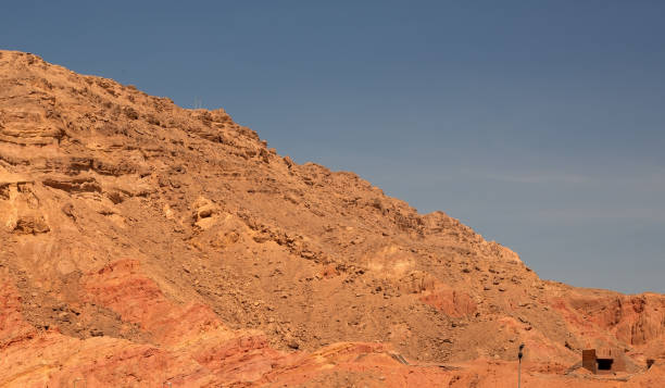 istock Red rocky mountain against the blue sky 1335003911