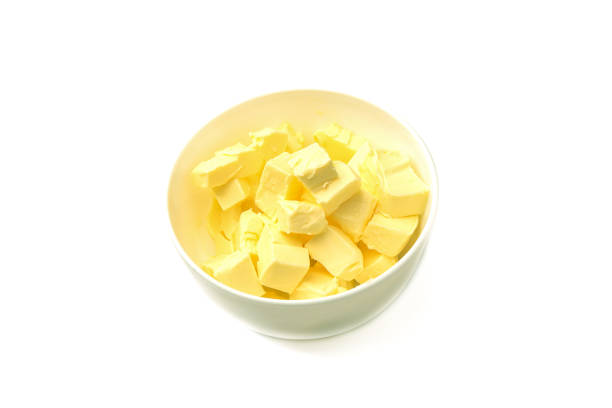 istock Top view of a white bowl with diced butter. 1335004412