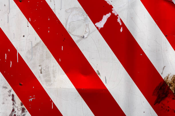 istock red and white diagonal stipes on flat steel sheet - caution road sign 1335004553