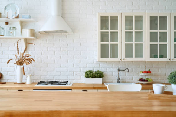 istock Kitchen wooden table top and kitchen blur background interior style scandinavian 1335007256