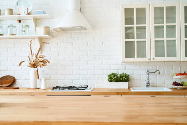 istock Kitchen wooden table top and kitchen blur background interior style scandinavian 1335007300