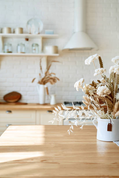 istock Kitchen wooden table top and kitchen blur background interior style scandinavian 1335007354