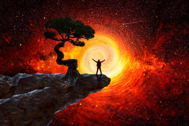 istock Man on top of a mountain observing the universe 1335008670