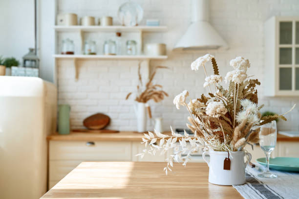 istock Kitchen wooden table top and kitchen blur background interior style scandinavian 1335008875