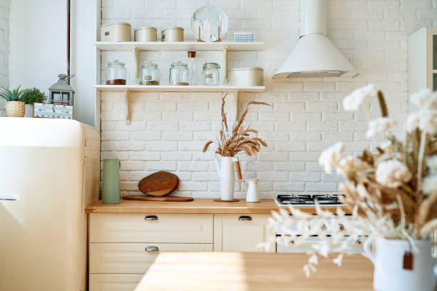 istock Kitchen wooden table top and kitchen blur background interior style scandinavian 1335009278