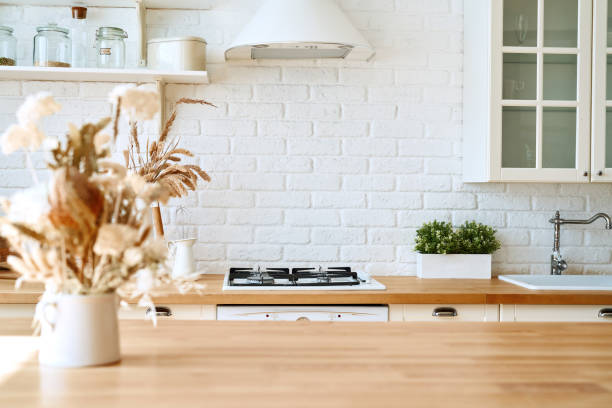 istock Kitchen wooden table top and kitchen blur background interior style scandinavian 1335009705