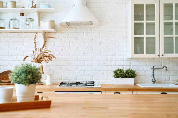 istock Kitchen wooden table top and kitchen blur background interior style scandinavian 1335009743