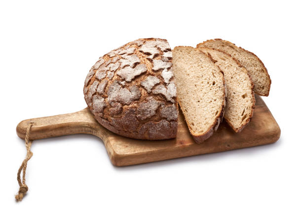 istock Sliced bread on wooden cutting board isolated on white background. 1335010611
