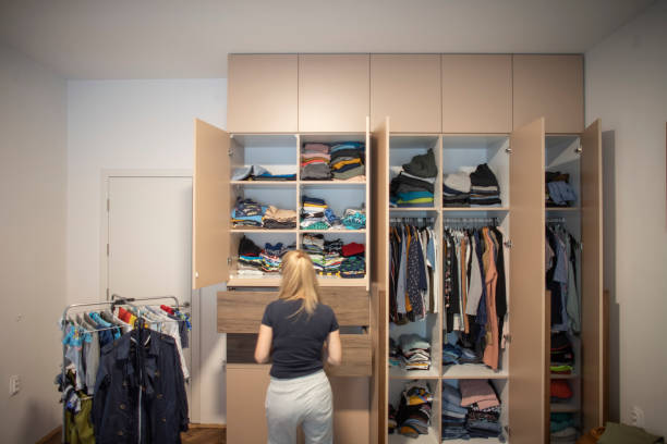 istock Woman reorganizing her wardrobe 1335010617
