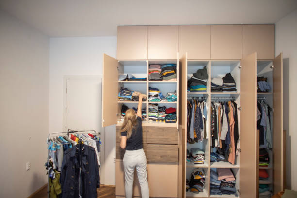 istock Woman reorganizing her wardrobe 1335010622
