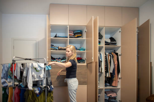 istock Woman reorganizing her wardrobe 1335010634