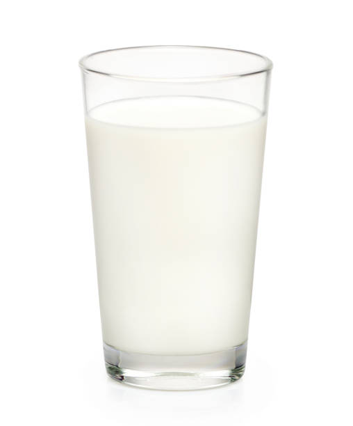 istock Glass of milk isolated on white background 1335011013