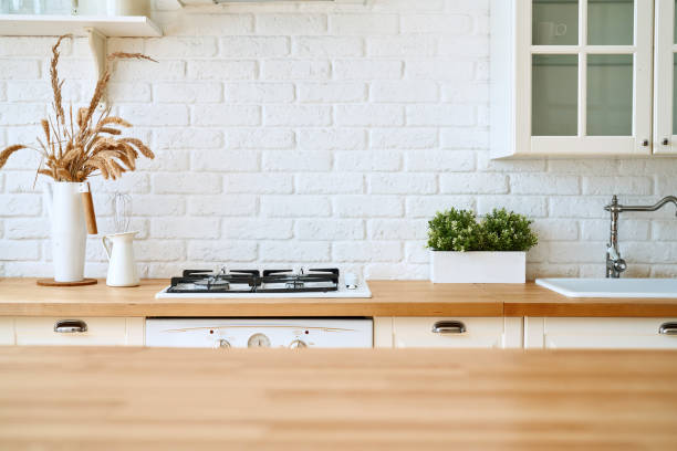 istock Kitchen wooden table top and kitchen blur background interior style scandinavian 1335011130