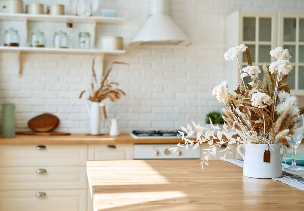 istock Kitchen wooden table top and kitchen blur background interior style scandinavian 1335011157
