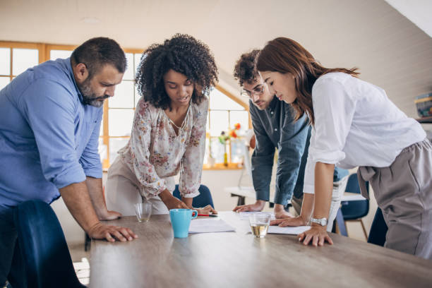 istock Young business team working together 1335013970