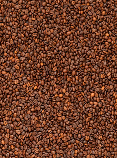 istock Fresh roasted coffee beans background. Top view. 1335019738