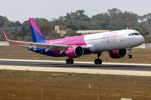 Luqa, Malta - August 17, 2021: Wizz Air Airbus A321-271NX (Reg.: G-WUKP) landing runway 31, arriving from the UK.