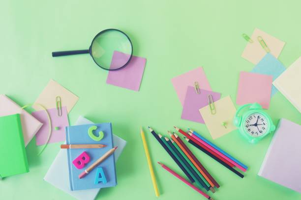 istock Books and stationery on bright background, top view 1335022446