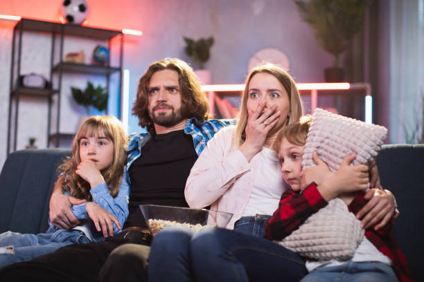 istock Family getting frightened while watching horror movie 1335022480