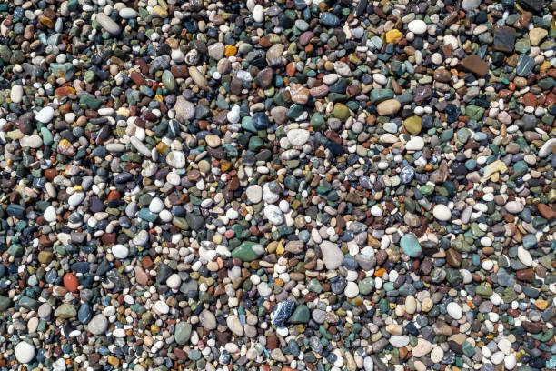 istock Multicolor beautiful shiny little pebbles on the sea shore 1335023489