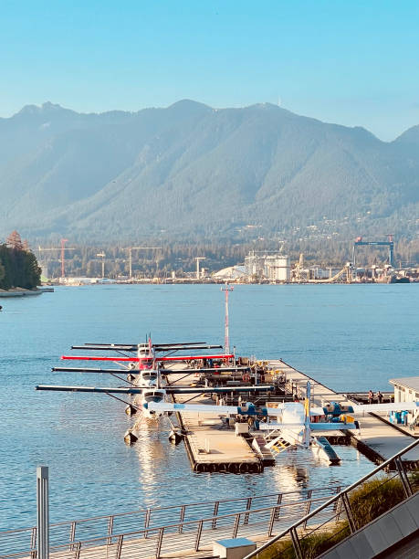 A float plane lands on Burrard Inlet near downtown Vancouver in the morning.