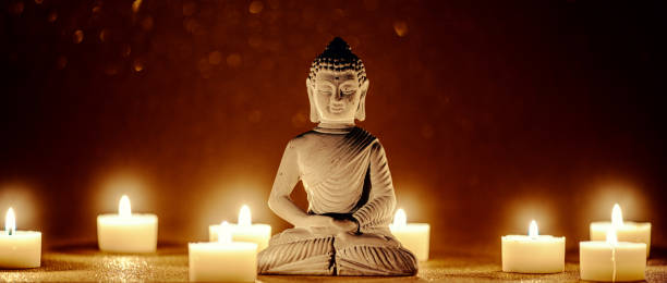 istock little buddha statue surrounded by tea candles 1335025282